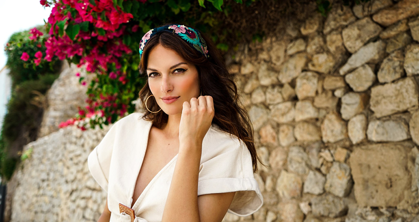 A model wearing clothing from Hats & Tiaras