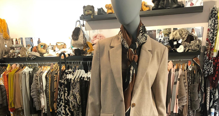 A mannequin wearing clothing from The Boutique