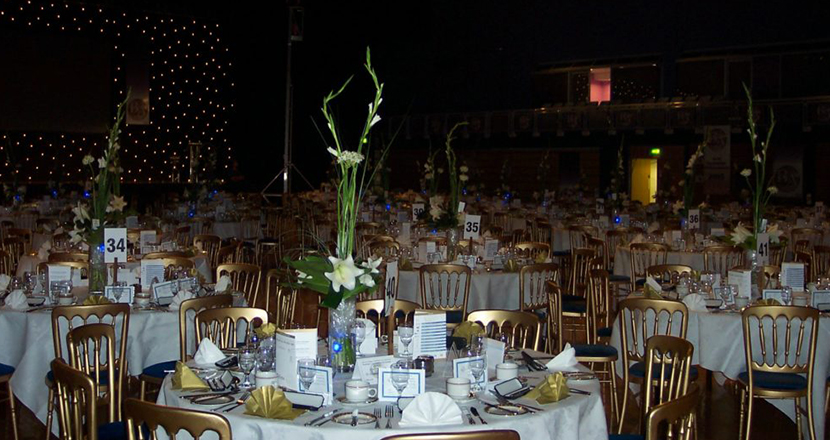 A photograph of dressed tables at Grimsby Auditorium