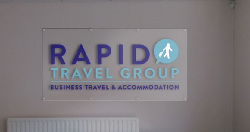 A photograph of Rapid Travel Group signage