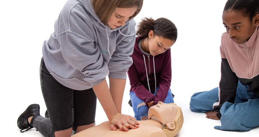 girls learning first aid