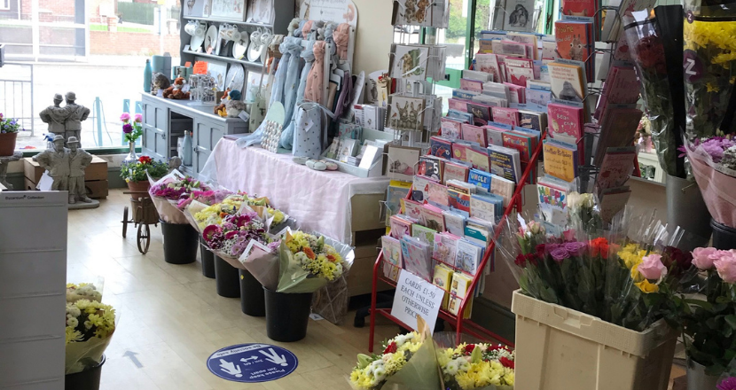 gift cards and flowers on display in store